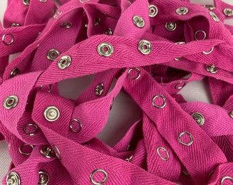 Hot pink metal snap tape sold by the yard