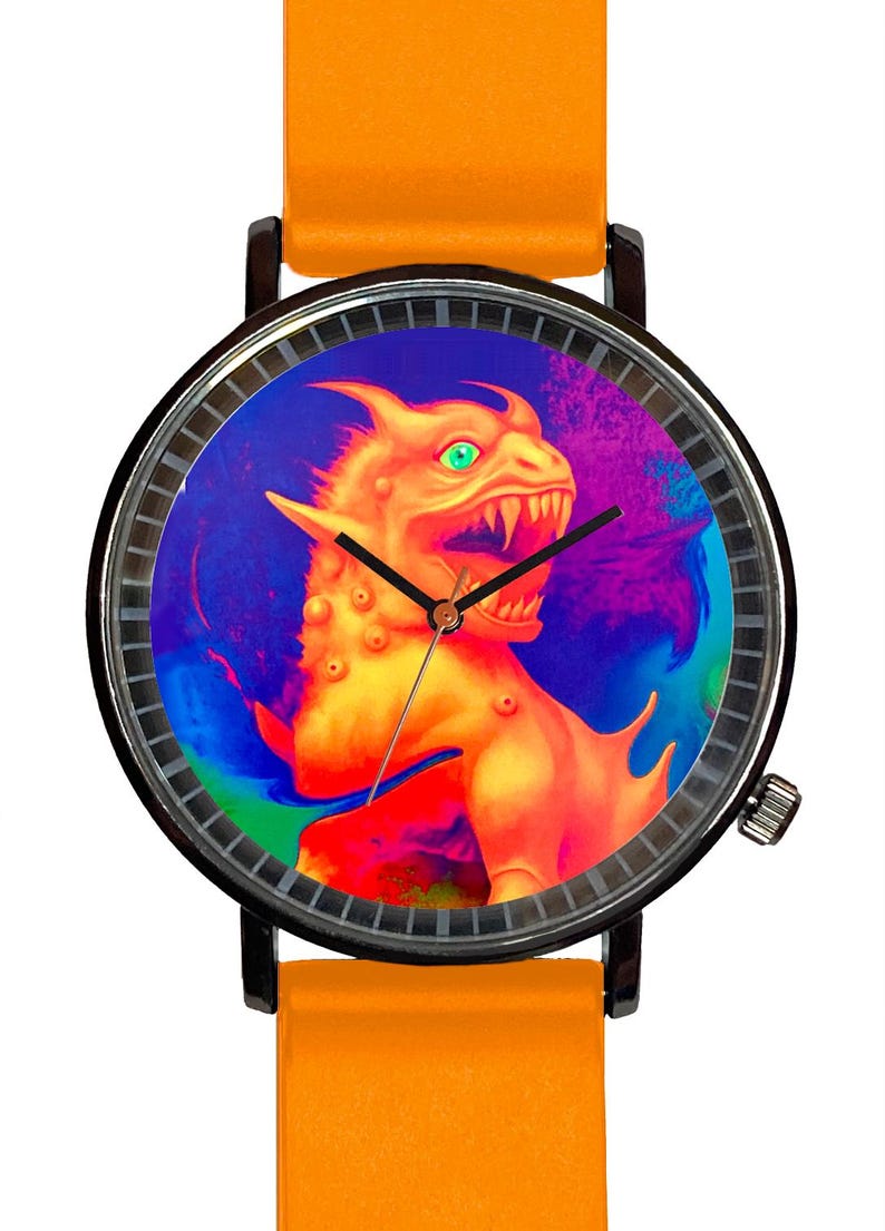 May include: A round wristwatch with a black case and an orange band. The watch face features a colorful illustration of a dragon with green eyes. The watch hands are black.