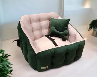 May include: A green and beige dog bed with a bone-shaped pillow. The bed has a quilted design and is made of soft fabric.