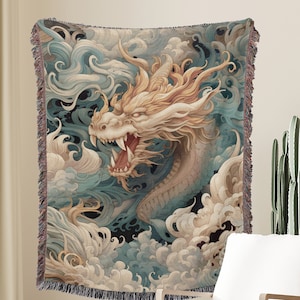 May include: A woven tapestry featuring a detailed illustration of a golden dragon emerging from swirling blue and white clouds. The dragon has sharp teeth and claws, and its eyes are wide open.