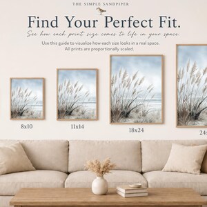 The image is a living room with a couch and a coffee table. There are four framed prints of the same size, ranging from 5x7" to 24x36", displayed on the wall. The prints are arranged in a row, with the largest one at the top and the smallest one at the bottom. The couch is positioned in front of the wall, and there is a vase of flowers on the coffee table.
