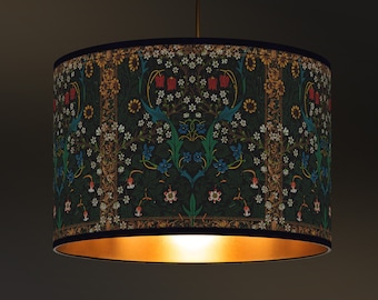 May include: A lampshade with a gold trim and a floral pattern in shades of green, blue, red, and white.
