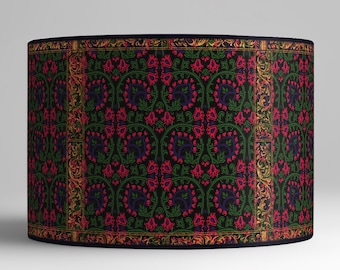 May include: A black lampshade with a repeating pattern of red flowers and green leaves on a dark background. The pattern is framed by a gold border.