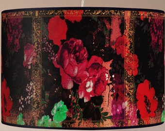 May include: A black lampshade with a floral pattern featuring red, pink, and green flowers on a black background with gold accents.
