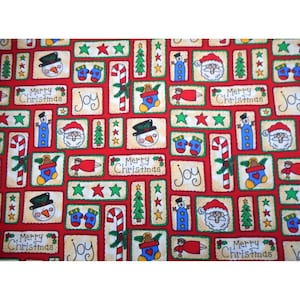May include: Festive red fabric with a repeating pattern of Christmas-themed illustrations. Rectangular blocks contain snowmen, Santa, trees, candy canes, and the words "Merry Christmas" and "Joy".