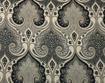 May include: A fabric featuring a repeating damask pattern in shades of black, charcoal gray, and light gray. The design consists of intricate, symmetrical scrollwork and teardrop-shaped motifs arranged in a dense, interconnected floral layout.