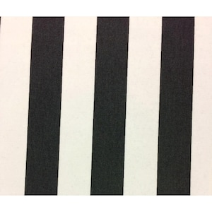 May include: Close-up of a fabric with a bold black and white striped pattern. The stripes are vertical and evenly spaced, creating a classic and graphic design. The fabric appears to be a medium weight, suitable for various sewing projects.