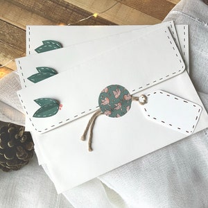 Enveloppe faites mains blanches