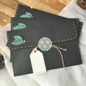 Enveloppe faites mains noires