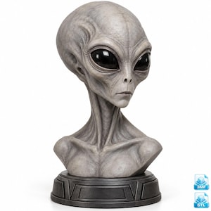 May include: A gray alien bust sculpture featuring a large, smooth, elongated cranium, prominent neck muscles, and deep-set, glossy black oval eyes. The figure is mounted on a dark, circular, tiered base with geometric detailing.