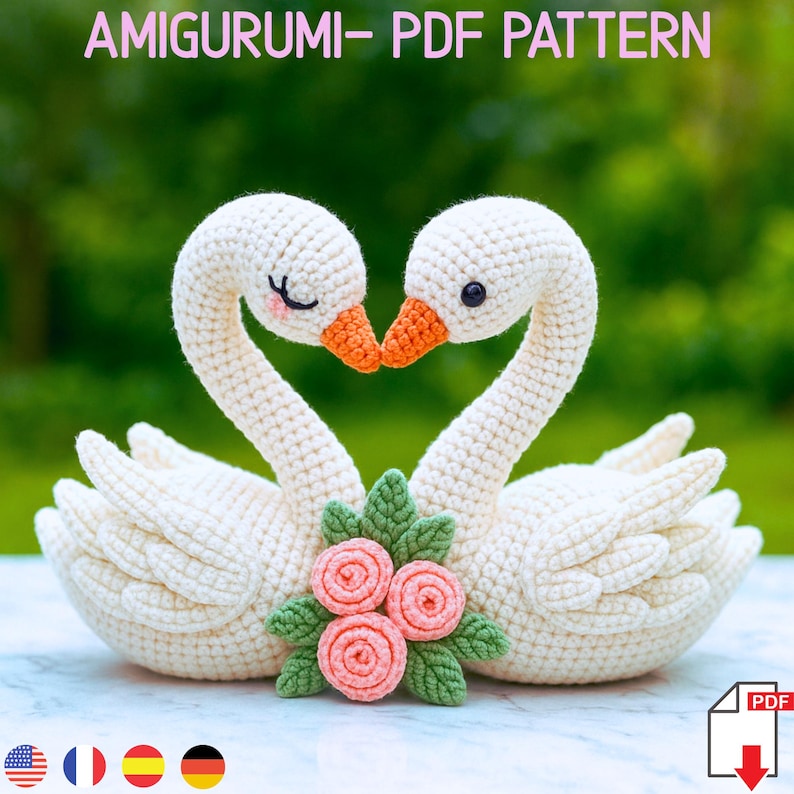 Crocheted swan couple with intertwined necks forming a heart, decorated with pastel flowers and embroidered details, displayed on a soft bed