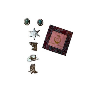 May include: A collection of gold-toned Western-themed jewelry, including two turquoise stud earrings, a sheriff star, a horse head, a cowboy hat, and a cowboy boot. A small box with the text "Premier Designs" is also included.
