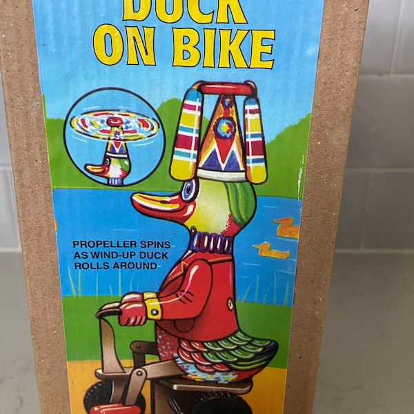 Duck on a Bike collectible tin toy 8.5"