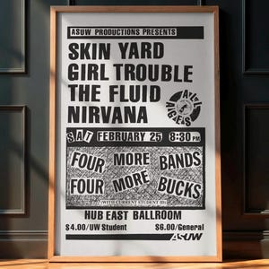 May include: A framed concert poster with a black and white design. The poster features the names of bands like Skin Yard and Nirvana, along with the date and time of the show. The poster is in a wooden frame.