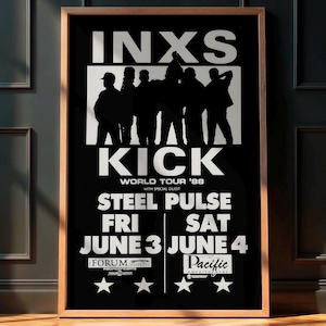 May include: A framed black and white poster featuring the band INXS. The poster promotes the KICK World Tour '88 with Steel Pulse. The concert dates are June 3 and June 4. The poster has a wooden frame.