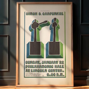 May include: Framed vintage poster for Simon & Garfunkel's concert at Philharmonic Hall, Lincoln Center. The poster features stylized figures in blue and green, with the band's name at the top and concert details below.