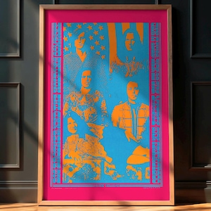 May include: A framed art print featuring a stylized portrait in shades of orange and blue. The artwork depicts several figures against a blue background with stars, framed by a pink border and a wooden frame. The print includes text.