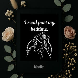May include: A black Kindle e-reader with the text "I read past my bedtime" and a line drawing of a person reading. The word "kindle" is printed at the bottom. The e-reader is surrounded by flowers and greenery.