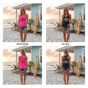 May include: A neon pink tank top with the text "HIGH VIBES" in white. The model is wearing denim shorts and sunglasses. A black tank top with the text "HIGH VIBES" in white. The model is wearing denim shorts and sunglasses. The background includes a beach scene with a surfboard.