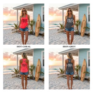 May include: Four images of tank tops with the text "HIGH VIBES" printed on them. The tank tops are hot coral and iron grey. The models are wearing denim shorts. The background is a beach scene with a surfboard.