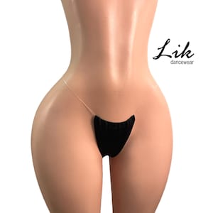 May include: Black sheer lingerie with a black velvet panel at the front. The lingerie is made by the brand "Lik dancewear".