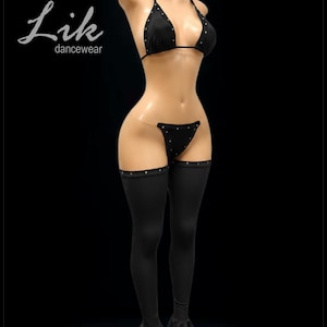 May include: Black dancewear set with rhinestone accents. The set includes a halter top bikini, a thong, and thigh-high leggings with flared bottoms. The brand name "Lik dancewear" is in the upper left corner.
