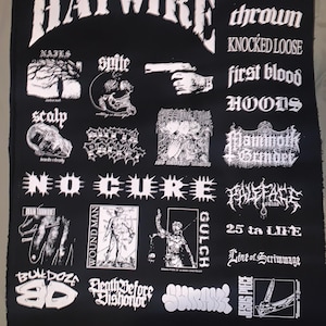 May include: Black fabric patch with white text and graphics. The word "HAYWIRE" arches across the top. Various band names and illustrations, including "NAILS," "spite," and "KNOCKED LOOSE," are displayed.