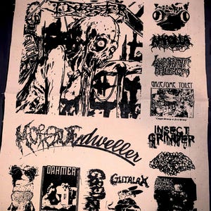 May include: A beige fabric featuring multiple black and white illustrations and text. The images include grotesque figures, skulls, and band logos such as "Morbid Dweller" and "Dahmer: Our Worst Recordings". The overall theme is related to underground music and art.