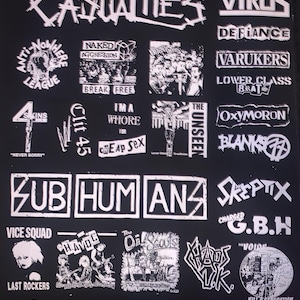 May include: Black graphic featuring numerous punk rock band logos in white. Bands include The Casualties, The Virus, Anti-Nowhere League, and Subhumans. Other logos include Naked Aggression, and G.B.H. The image has a distressed, vintage aesthetic.