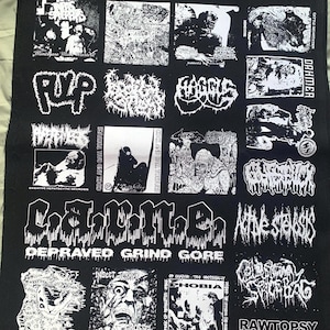 May include: Black fabric patch featuring multiple white graphic designs and text. The patch includes band logos and phrases like "Depraved Grind Gore" and "Insect Terror." The overall theme is related to music and subculture.