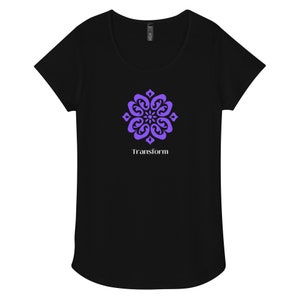 May include: Black t-shirt featuring a purple mandala design and the word "Transform" in white text.