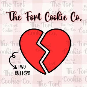 May include: Two cookie cutters in the shape of a broken heart. The cutters are red with black outlines. The text "The Fort Cookie Co." and "TWO CUTTERS" are also included in the image.