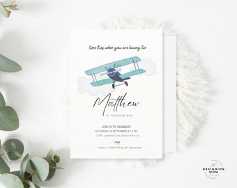 May include: A white birthday invitation card featuring a watercolor illustration of a light blue biplane flying among clouds. The text reads: time flies when you are having fun, Matthew is turning one, join us to celebrate, Saturday, 16 September at 4 PM.