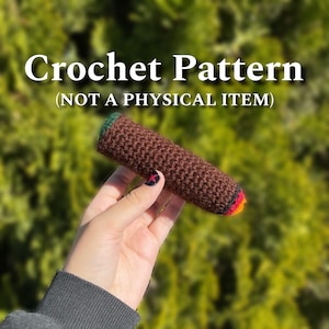 Peut inclure: Modèle de crochet pour un cigare en crochet marron, vert, rouge et jaune. Le modèle n'est pas un article physique.