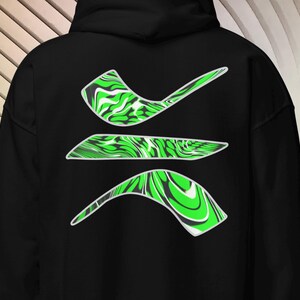 May include: A black hooded sweatshirt featuring a graphic design on the back composed of three distinct, curved shapes. Each shape displays a vibrant, swirling pattern of bright green, black, and white colors, creating a fluid, marbled effect.