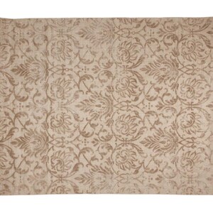 May include: Beige rectangular rug with a repeating floral pattern in shades of brown. The rug has a distressed, vintage look, with the floral design covering the entire surface. The rug is suitable for living rooms, bedrooms, or entryways.