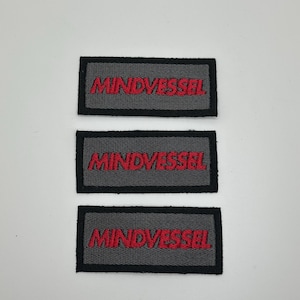 May include: Three gray fabric patches with black borders and red embroidered text that reads "MINDVESSEL".
