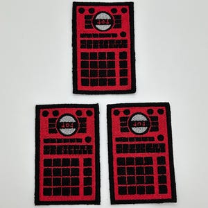 May include: Three red and black embroidered patches with a circular design and the text "101" in white. The patches are rectangular and have a black border.