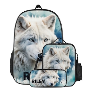 May include: A backpack, lunch bag, and pencil case set featuring a white wolf portrait against a blue watercolor background. The name RILEY is printed in bold black letters on the pencil case and partially visible on the backpack.