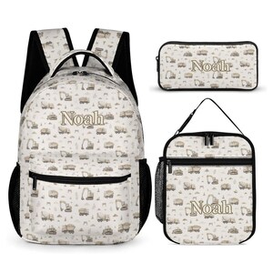 May include: A backpack, a rectangular pencil case, and a lunch bag, all featuring a light-coloured pattern of construction vehicles and the name Noah printed in a tan font. Each item has black zips, black trim, and black mesh side pockets.