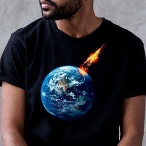May include: A black t-shirt with a graphic of a fiery comet crashing into a blue and green Earth.