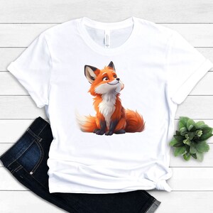 May include: White t-shirt with a cartoon image of a smiling orange fox looking up.