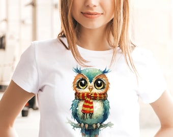 May include: White t-shirt with a watercolor illustration of a blue owl wearing a red and yellow scarf.