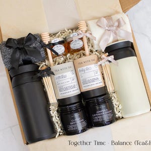 A gift box designed for two. Includes two stainless steel tumblers, a selection of fine tea and honey, elegant match jars, uniquely scented candles, and cozy socks for both. Ideal for creating shared moments of relaxation and connection.