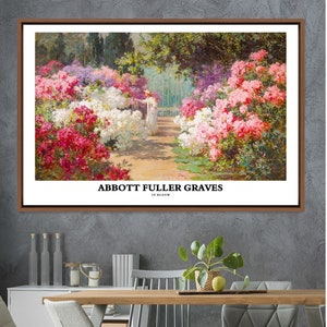 May include: A framed painting of a garden scene with a woman in a white dress walking through a path lined with pink and white flowers. The painting is titled "Abbott Fuller Graves" in black text at the bottom.