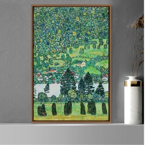May include: A framed painting of a landscape with a lake and trees. The painting is in a style reminiscent of Gustav Klimt, with a focus on geometric shapes and patterns. The colors are muted and earthy, with shades of green, brown, and blue.