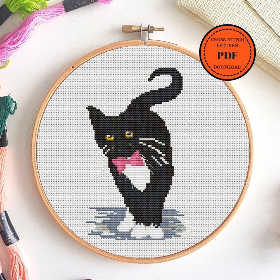 a needlepoint cat