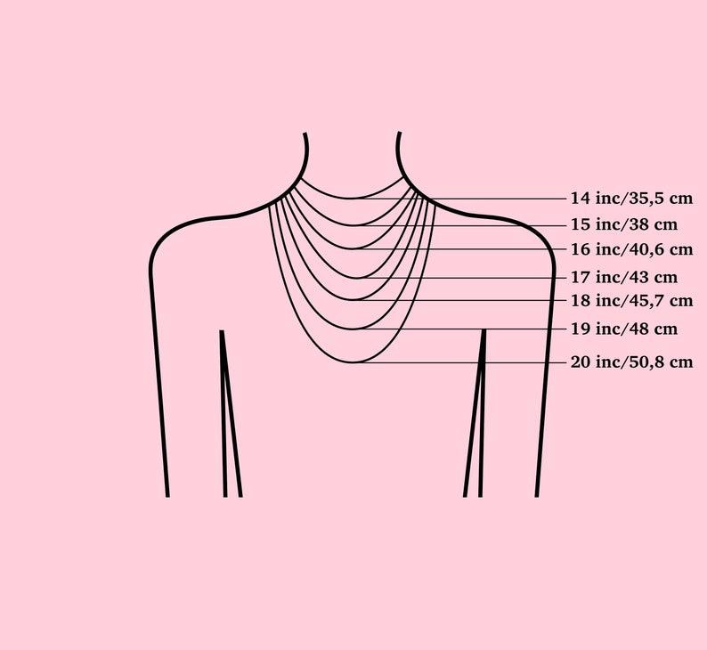 K&ouml;nnte beinhalten: Ein Diagramm, das Halskettenl&auml;ngen von 35,5 cm bis 50,8 cm auf einer stilisierten Torso-Umrisslinie zeigt. Das Bild hat einen rosa Hintergrund und schwarze Linien, die die Halskettenl&auml;ngen angeben.