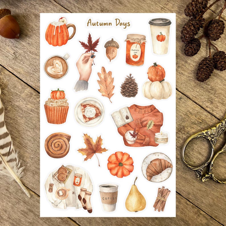 May include: A sheet of stickers with an autumn theme. The stickers feature images of coffee, pastries, pumpkins, leaves, sweaters, and other fall-themed items. The text "Autumn Days" is at the top of the sheet.
