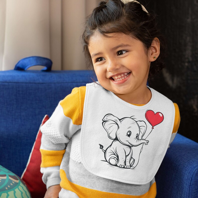 May include: A white baby bib with a black and white illustration of an elephant holding a red heart-shaped balloon. The bib has a yellow and white striped trim.
